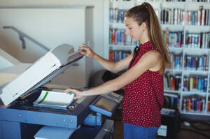 girl using photocopier