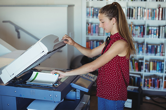 girl using photocopier